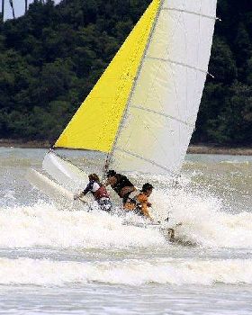 Punching the trimaran through the surf