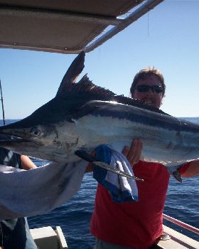 my dad (on the right) with 70kg+  black marlin  caught with 20kg rod