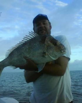 my brother and i with 2 moretonbay snapper