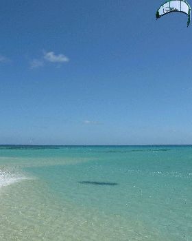 Flat clear water and miles of it right in the wind belt off Port Douglas