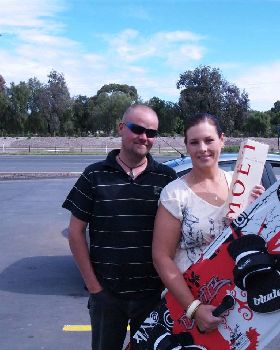 Brett and Belinda bringing the blade back and grabbing a bottle of Moet
