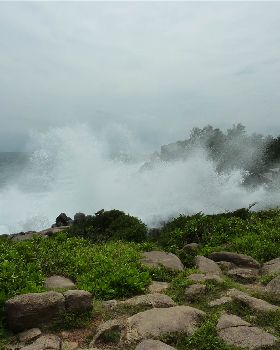 Swell breaking over hotel