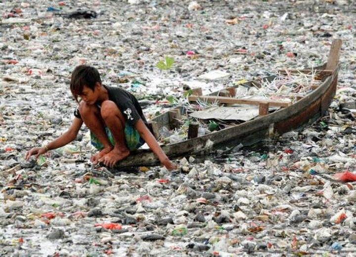 Citarum River Indonesia Kid Picking Thru Rubbish