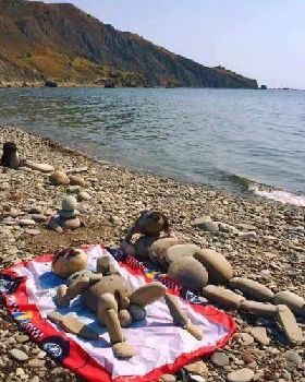sunbathers rock