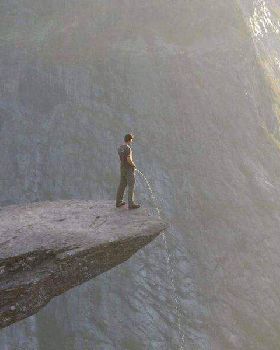 peeing off rock