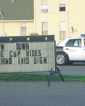 copbehindsign