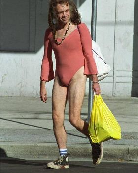man-carrying-a-shopping-bag-and-wearing-a-weird-pi1