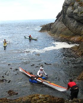 Landing 6 composite sea kayaks on Albatross Island