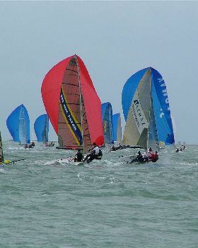 Around the top mark 16 Skiffs at RQYS