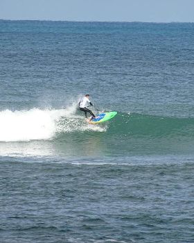 Qld SUP surfing team members in action