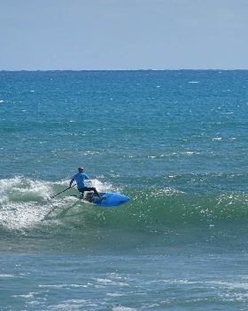 Qld SUP surfing team members in action