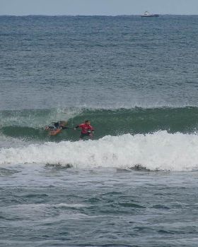 Qld SUP surfing team members in action