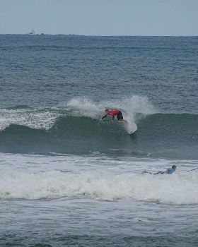 Qld SUP surfing team members in action