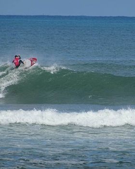 Qld SUP surfing team members in action