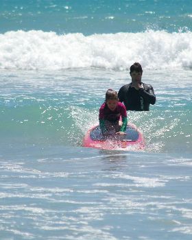 Kids learn to surf