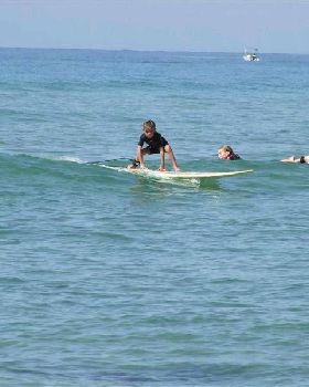 Ebony (6 years) Having a surf on her new glass board.