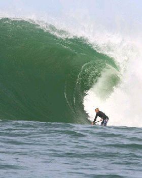 Jamie Mitchell charging on a SUP