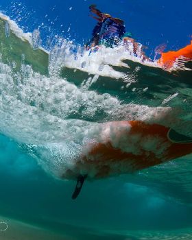 PAUL underneath board wave