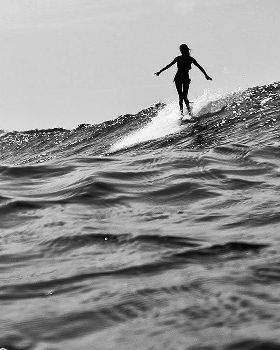 girl-longboarding-surfing-bw