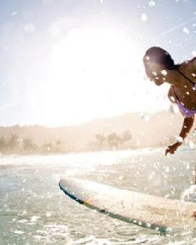girl-longboarding-surf