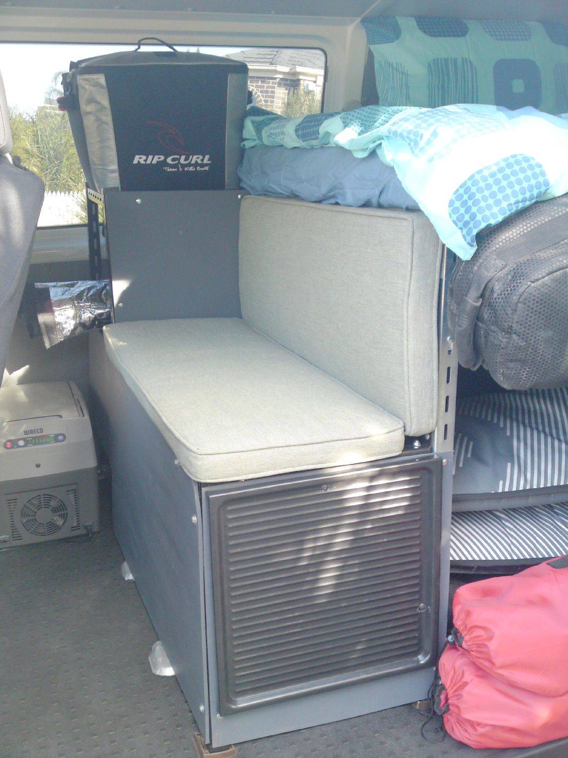 Bit washed out photo of the bench seat and fridge