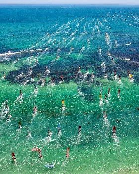 Windsurfers heading out