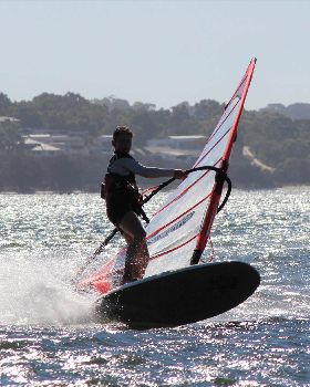 kid windsurfing