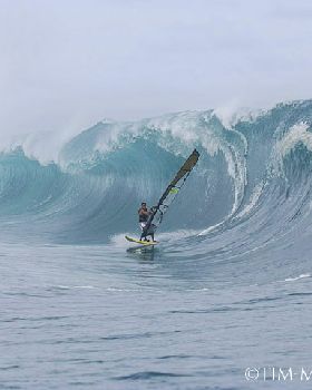 Tackling Teahupoo on a windsurfer