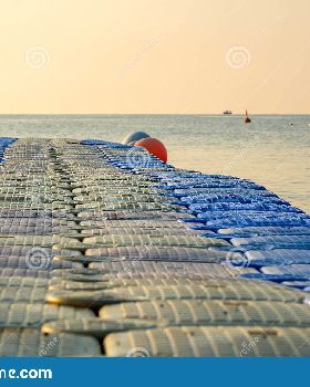 plastic-pontoon-sea-going-distance-swimming-background-lone-ship-out-focus-167120460