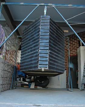 Windsurfing Trailer Box, suspended by lifting frames while trailer is on other duties
