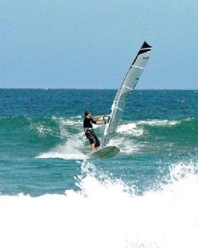 Getting some good waves and getting smashed on my SUP