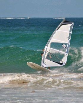 Getting some good waves and getting smashed on my SUP