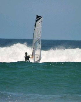 Getting some good waves and getting smashed on my SUP