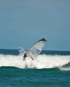 Getting some good waves and getting smashed on my SUP