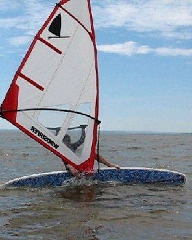 Windsurfing on a SUP - riding a stern-first railride